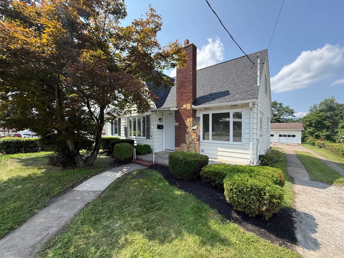 Renovated front exterior of 4036 Birney Avenue in Moosic after House Buying Solutions PA completed the project